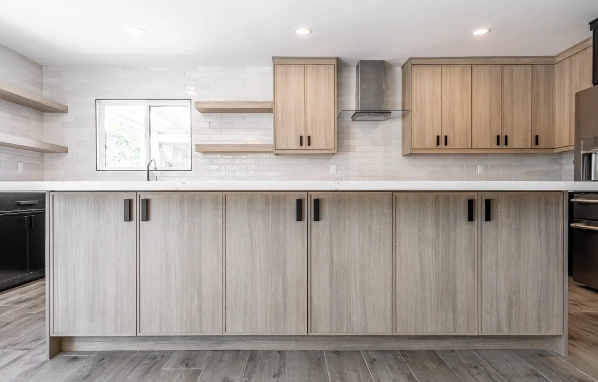 Kitchen with light oak island and open shelving