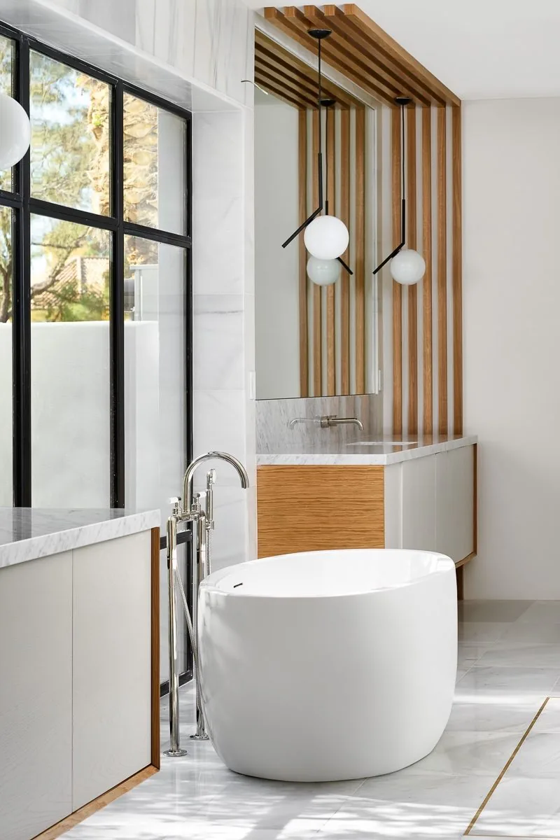 Bathroom with standalone tub and wood slat accent